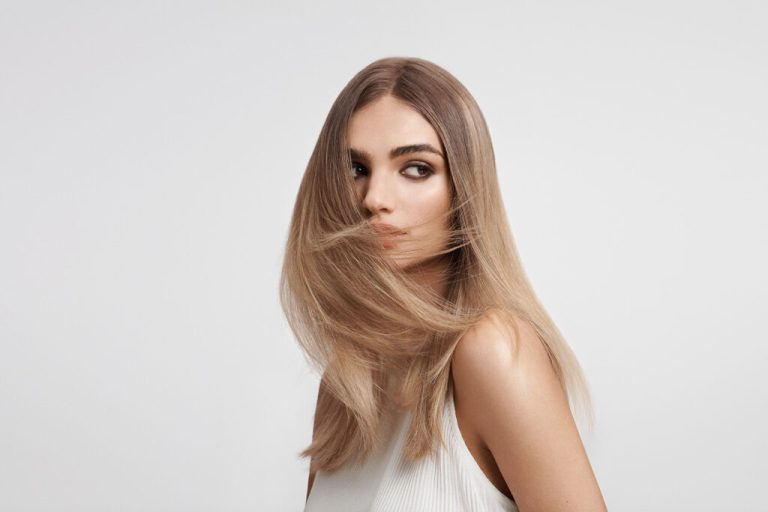 Model with long blonde hair for Goldwell's Bond Pro Hair Treatment range