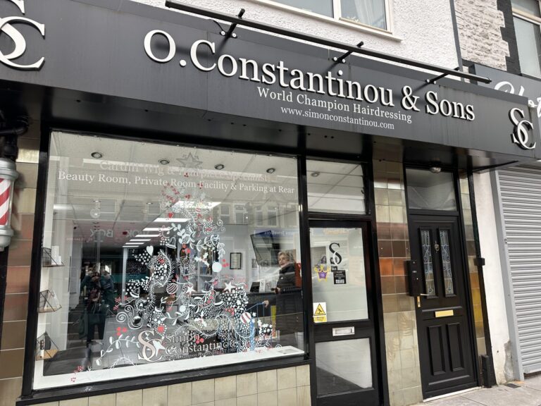 Christmas window using paint pens at Simon Constantinou Hairdressers Cardiff 2023