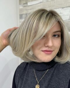 Cool Blonde Balayage Bob with sweeping fringe by Leonie at Simon Constantinou Hairdressers Cardiff