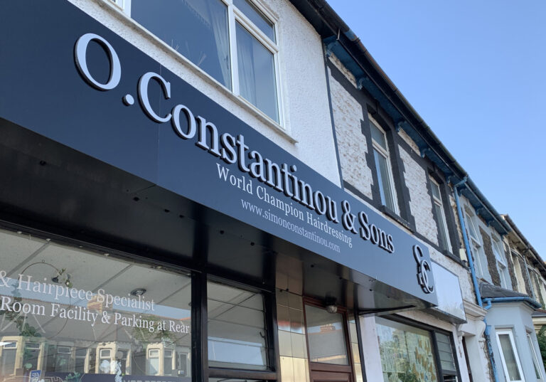 Simon Constantinou at O.Constantinou & Sons. 99 Crwys Rd, Cardiff - front of shop