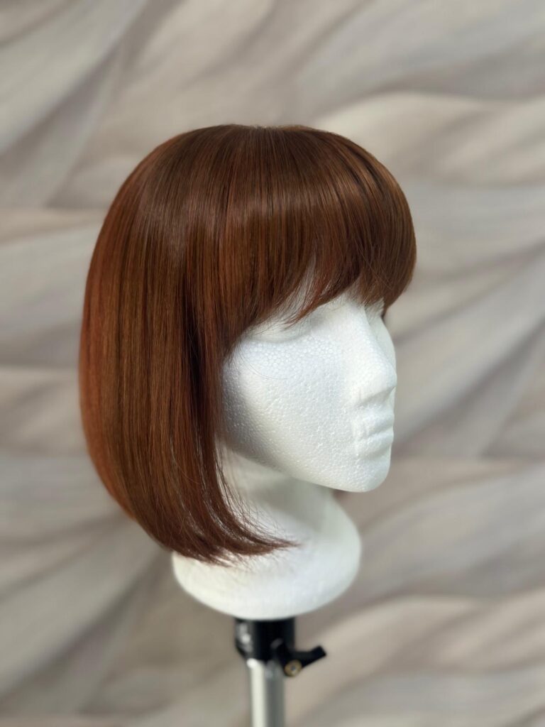 Red Hair Synthetic Bob Wig with Fringe at Simon Constantinou Hair Salon in Cardiff